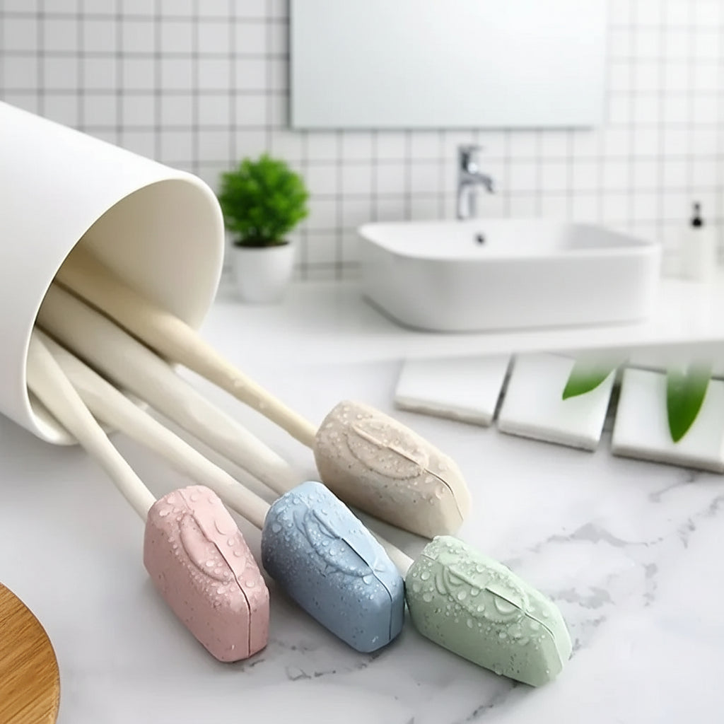Set of pastel-colored soap bars with wooden spoons on a marble surface.